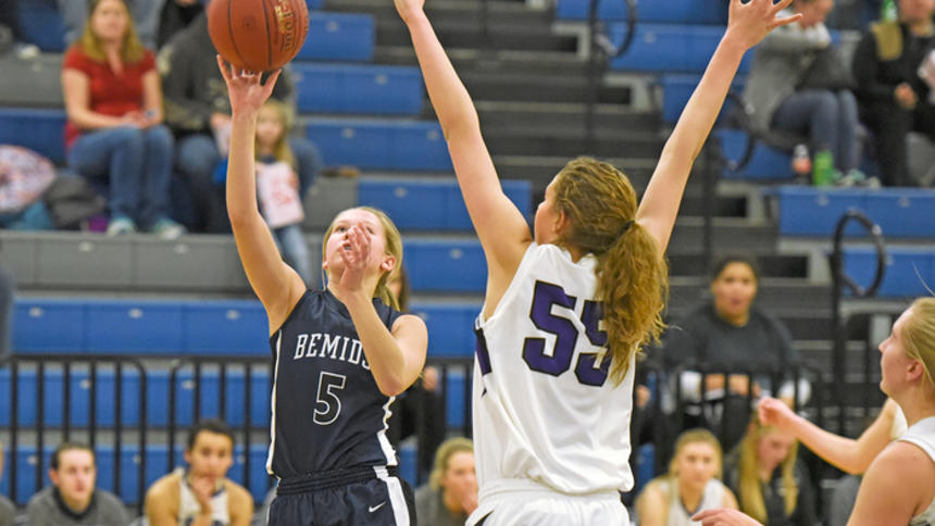 Bemidji High School freshman Lindsey Hildenbrand tosses the ball up to score for the Lumberjacks in the first half of the game against Cloquet on Saturday at BHS.