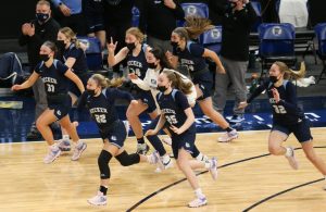 Becker players stream onto the floor to celebrate their 70-58 victory over Marshall in the Class 3A championship game at Target Center Friday night. Photo by Jeff Lawler, SportsEngine
