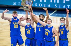 Waseca's Andrew Morgan (23), Ryan Dufault (12), Tyreese Willingham (1), Zach Hoen (20) and Matt Seberson (32) celebrate with the Class 2A trophy.

Target Center, Class 2A championship Waseca vs. Caledonia  April  10, 2021   Photo by Earl J. Ebensteiner, SportsEngine