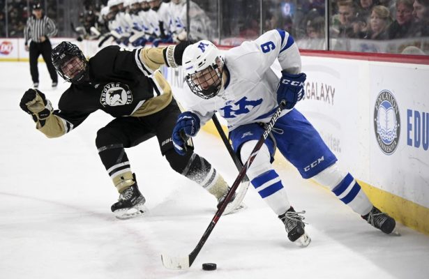 Minnetonka forward Jack Sand (9) controls the puck as he’s pursued by Andover defenseman Drew Law (2) during the second period of a boys hockey state tournament Class 2A semifinal game Friday, March 10, 2023 at the Xcel Energy Center in St. Paul, Minn..      ] AARON LAVINSKY • aaron.lavinsky@startribune.com